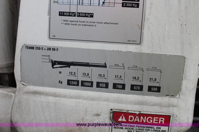 image for item H3580 1998 Peterbilt 320 flatbed truck with knuckle boom crane