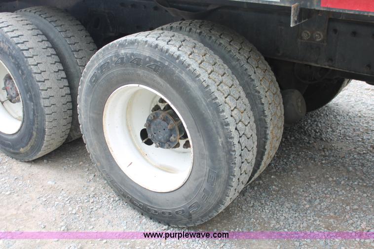 image for item H3580 1998 Peterbilt 320 flatbed truck with knuckle boom crane