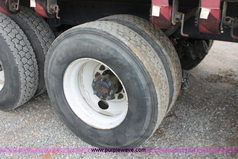 image for item H3580 1998 Peterbilt 320 flatbed truck with knuckle boom crane