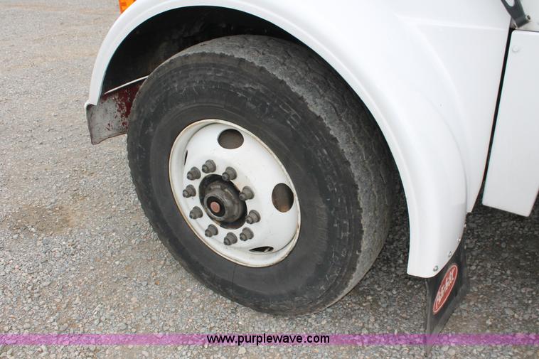 image for item H3580 1998 Peterbilt 320 flatbed truck with knuckle boom crane