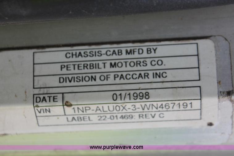 image for item H3580 1998 Peterbilt 320 flatbed truck with knuckle boom crane