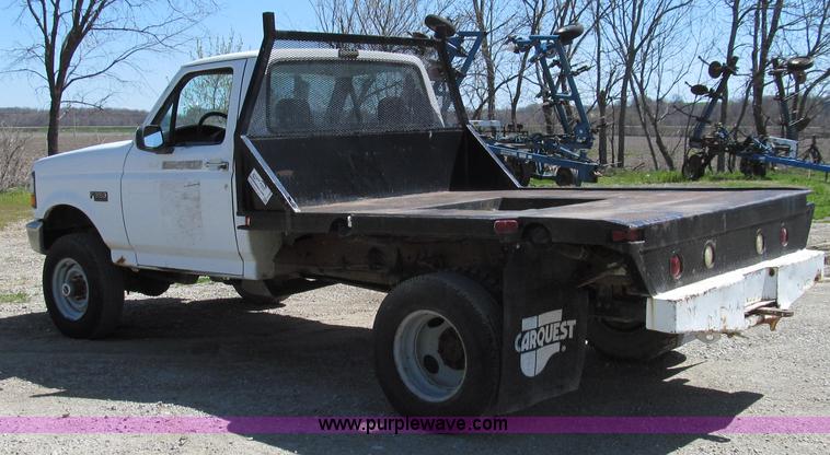 image for item E3920 1993 Ford F350 XL flatbed pickup truck