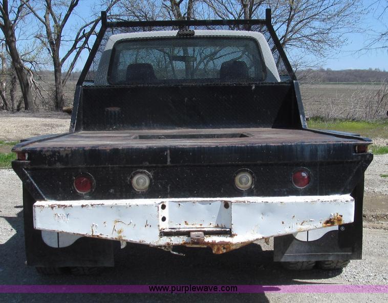 image for item E3920 1993 Ford F350 XL flatbed pickup truck