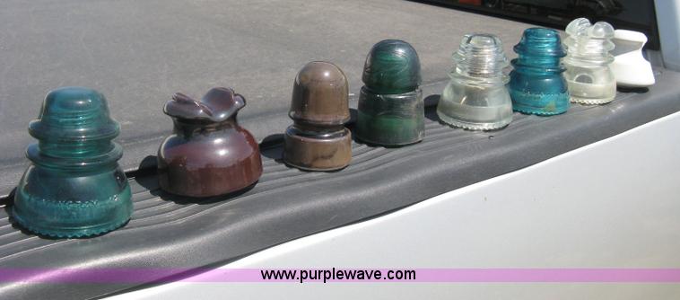 image for item AG9788 (12.5) drums of vintage glass insulators