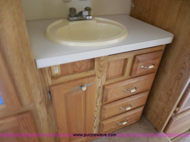 image for item H3182 1992 Nuwa Hitchhiker fifth wheel camper