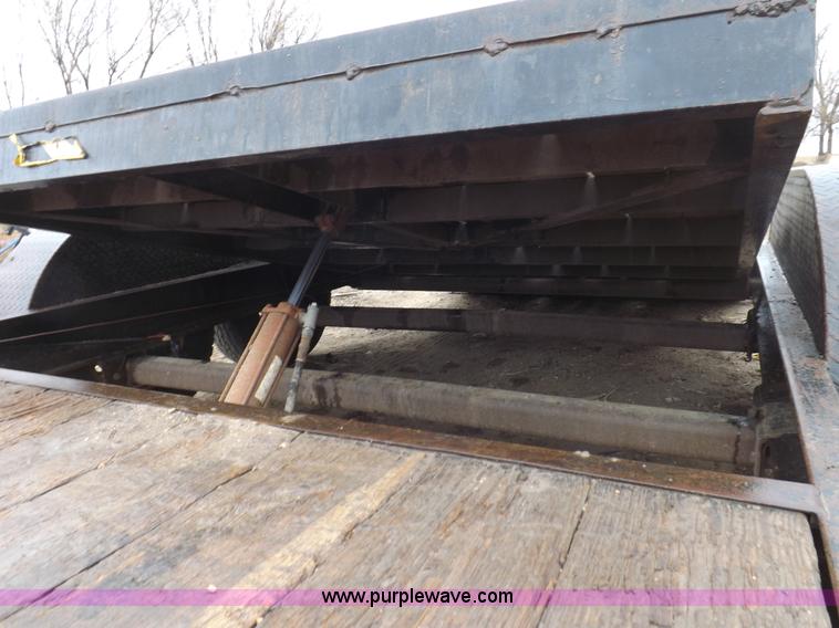 image for item H7215 2002 Neal tandem axle tilt deck trailer