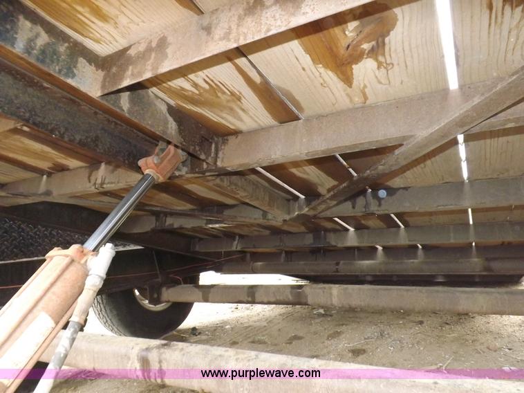 image for item H7215 2002 Neal tandem axle tilt deck trailer