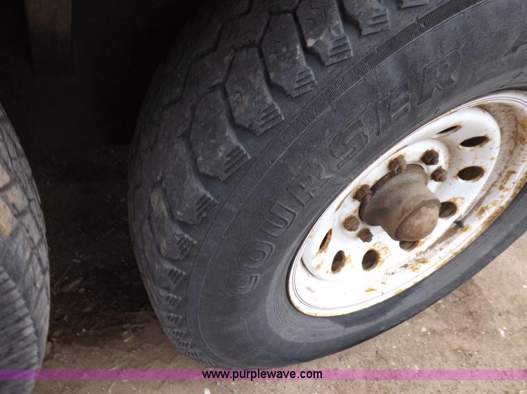 image for item H7215 2002 Neal tandem axle tilt deck trailer