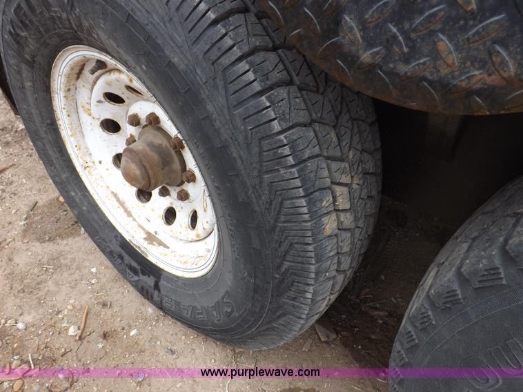 image for item H7215 2002 Neal tandem axle tilt deck trailer