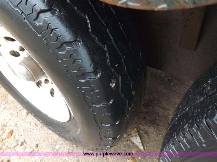 image for item H7215 2002 Neal tandem axle tilt deck trailer