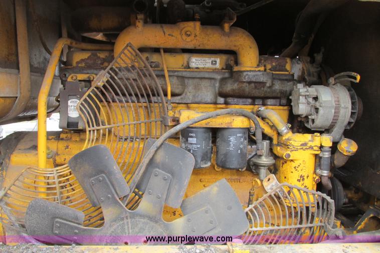 image for item F4820 1988 John Deere 670B articulated motor grader