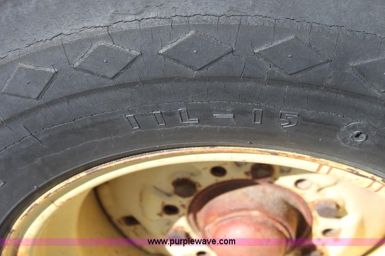 image for item F8623 New Holland 1010 small square bale stack wagon