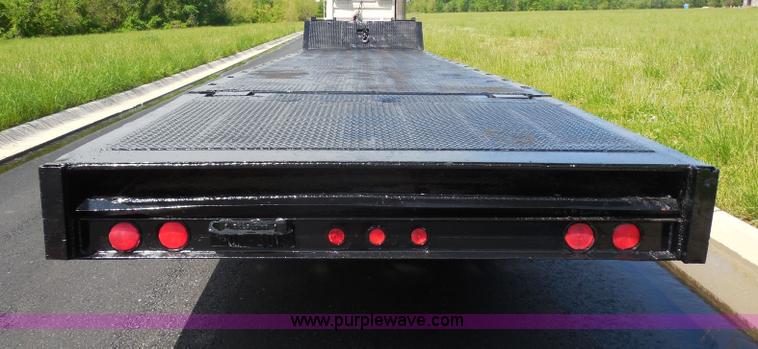 image for item H3195 1977 Multiquip hydraulic dovetail lowboy trailer