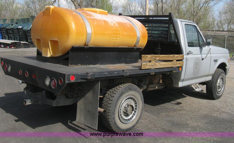 image for item E3481 1993 Ford F250 XL flatbed truck