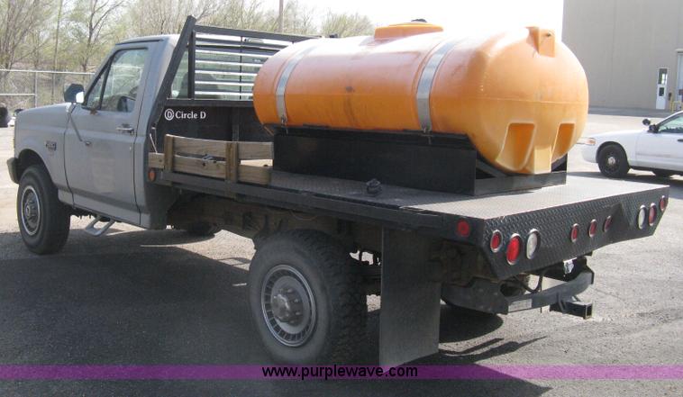 image for item E3481 1993 Ford F250 XL flatbed truck