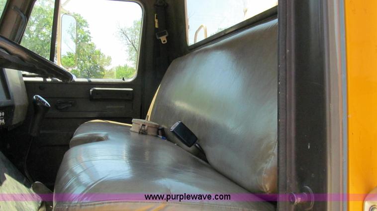 image for item E3946 1993 International 4900 flatbed truck water truck