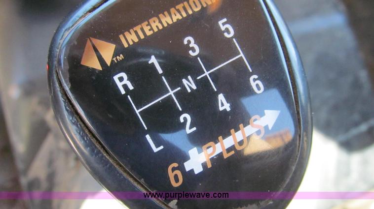 image for item E3946 1993 International 4900 flatbed truck water truck