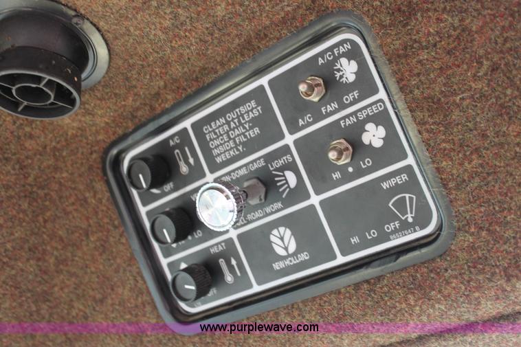 image for item AE9234 1997 New Holland 2450 self-propelled swather