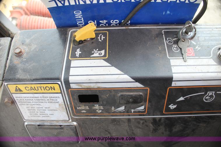 image for item AE9234 1997 New Holland 2450 self-propelled swather