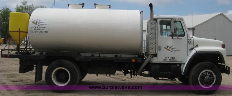 image for item D8299 1982 International 1954 flatbed tender truck