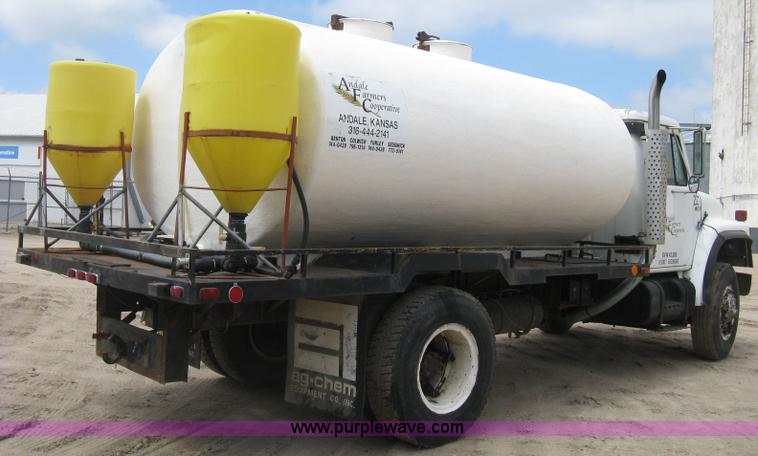 image for item D8299 1982 International 1954 flatbed tender truck