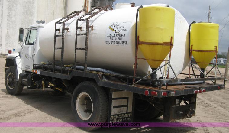 image for item D8299 1982 International 1954 flatbed tender truck