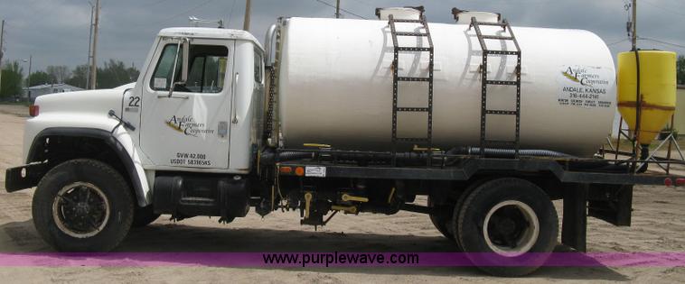 image for item D8299 1982 International 1954 flatbed tender truck