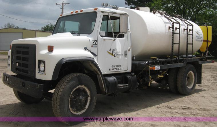 image for item D8299 1982 International 1954 flatbed tender truck