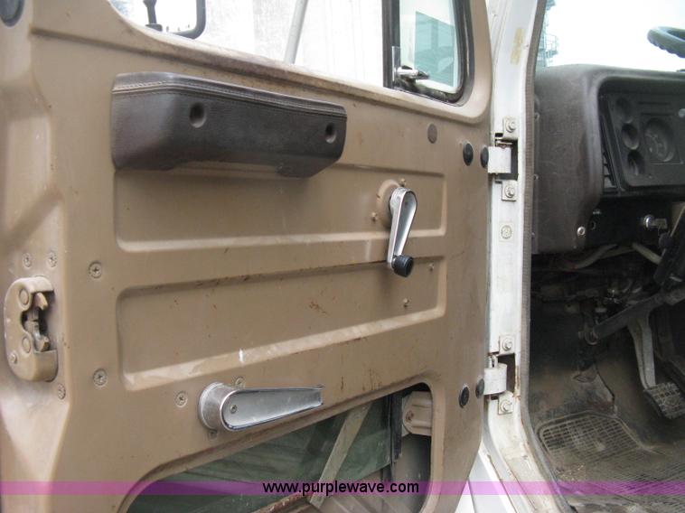 image for item D8299 1982 International 1954 flatbed tender truck