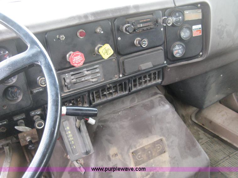 image for item D8299 1982 International 1954 flatbed tender truck