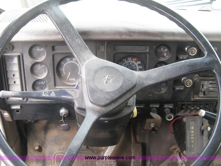 image for item D8299 1982 International 1954 flatbed tender truck