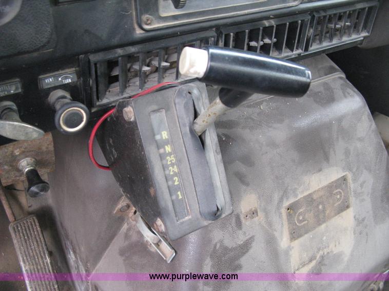 image for item D8299 1982 International 1954 flatbed tender truck