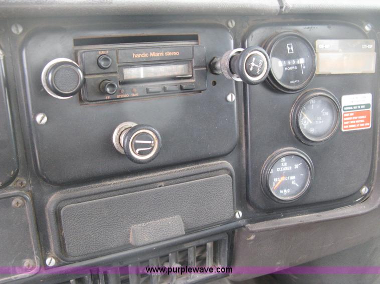 image for item D8299 1982 International 1954 flatbed tender truck