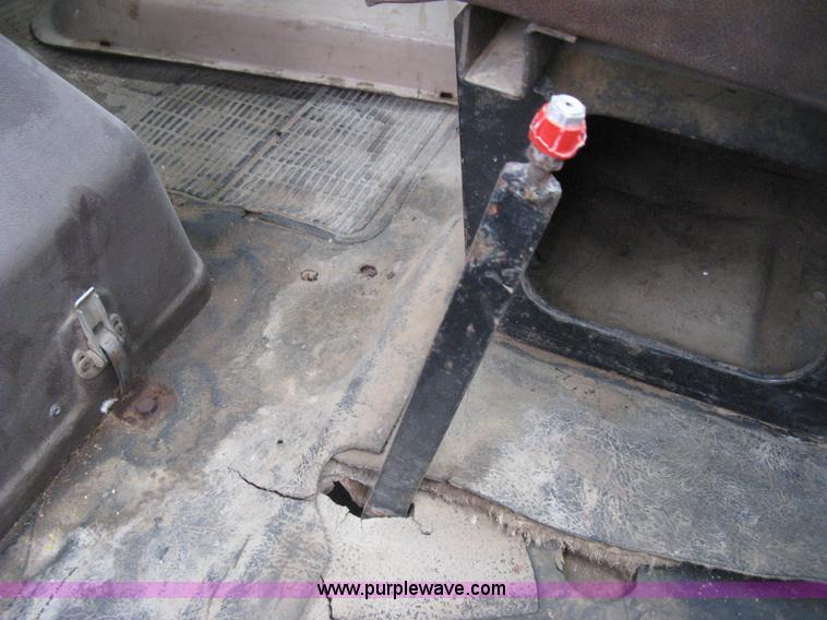 image for item D8299 1982 International 1954 flatbed tender truck