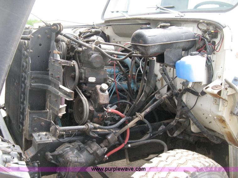 image for item D8299 1982 International 1954 flatbed tender truck