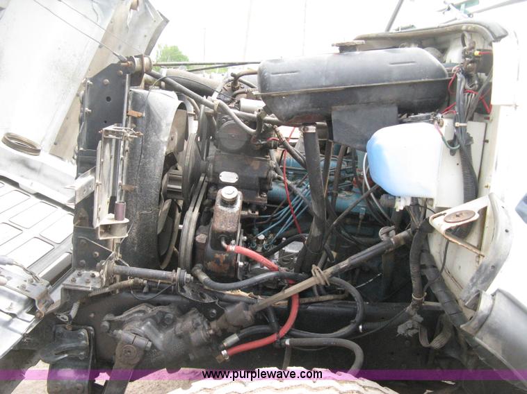 image for item D8299 1982 International 1954 flatbed tender truck