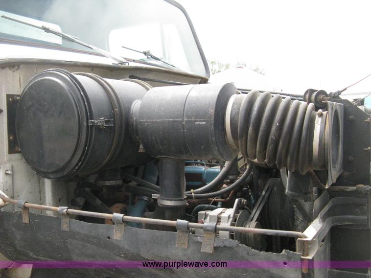 image for item D8299 1982 International 1954 flatbed tender truck