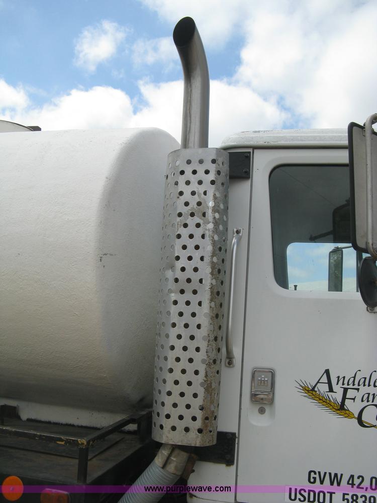 image for item D8299 1982 International 1954 flatbed tender truck