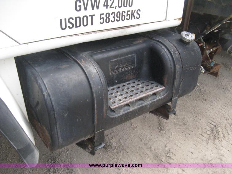 image for item D8299 1982 International 1954 flatbed tender truck