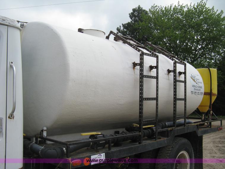 image for item D8299 1982 International 1954 flatbed tender truck