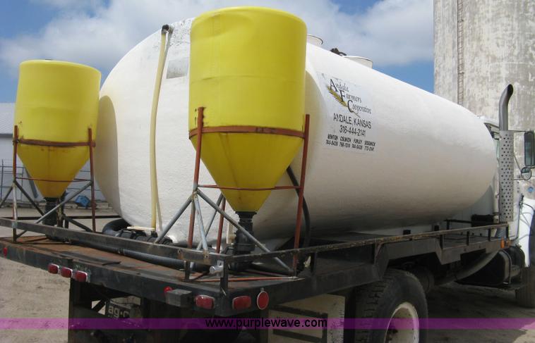 image for item D8299 1982 International 1954 flatbed tender truck