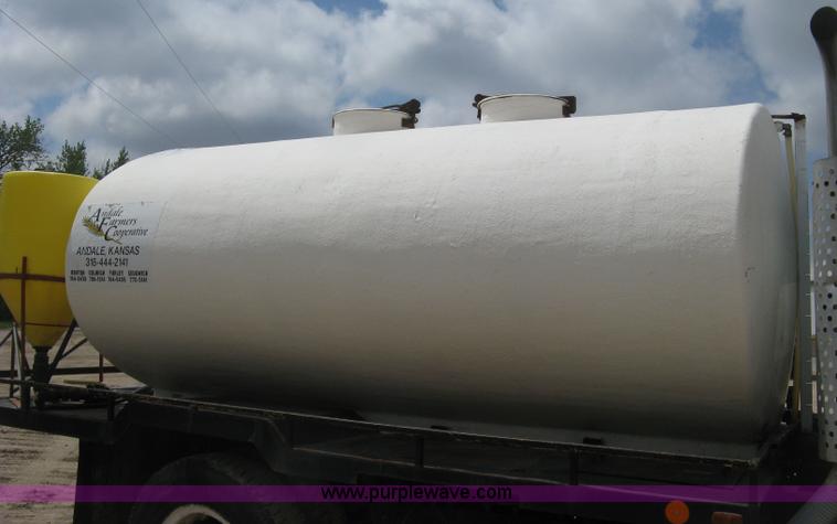 image for item D8299 1982 International 1954 flatbed tender truck