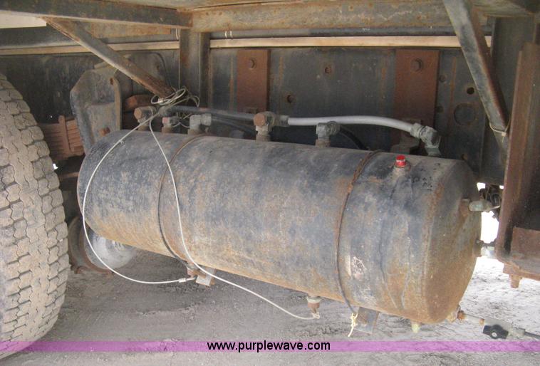 image for item D8299 1982 International 1954 flatbed tender truck