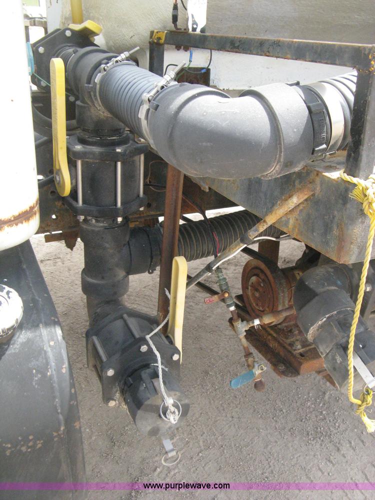 image for item D8299 1982 International 1954 flatbed tender truck