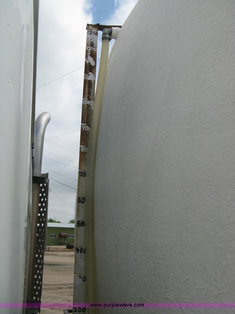 image for item D8299 1982 International 1954 flatbed tender truck