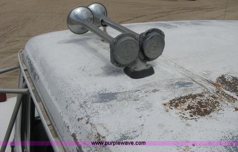 image for item D8299 1982 International 1954 flatbed tender truck