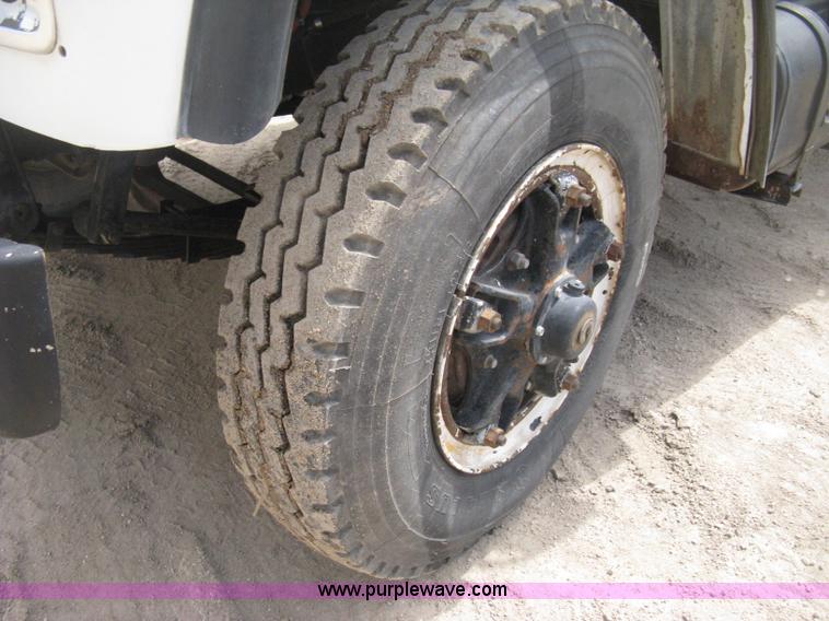 image for item D8299 1982 International 1954 flatbed tender truck