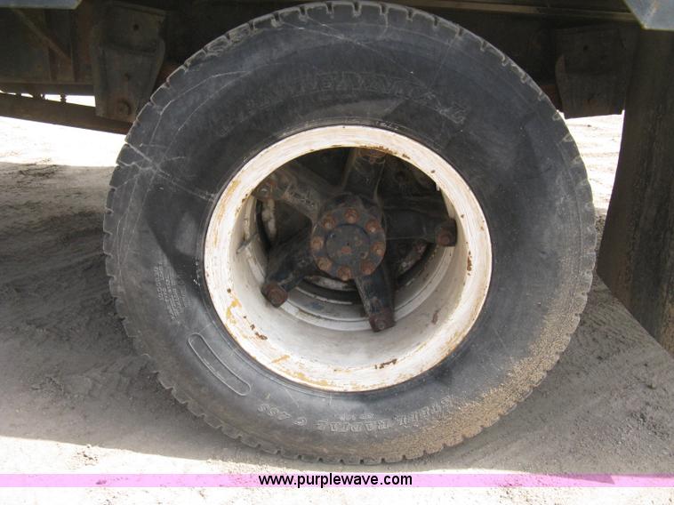 image for item D8299 1982 International 1954 flatbed tender truck