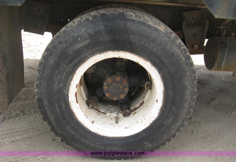 image for item D8299 1982 International 1954 flatbed tender truck