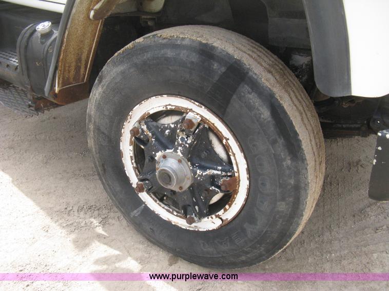 image for item D8299 1982 International 1954 flatbed tender truck